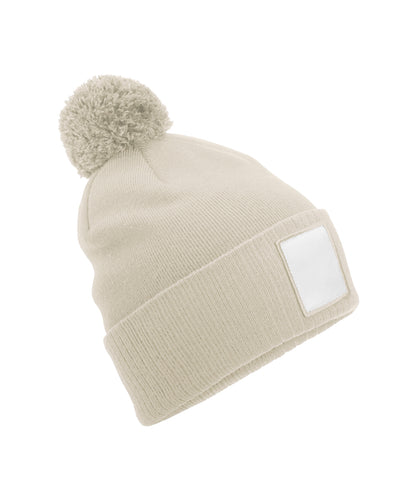 Beechfield B338R Appliqué patch pom beanie in Oatmeal/White